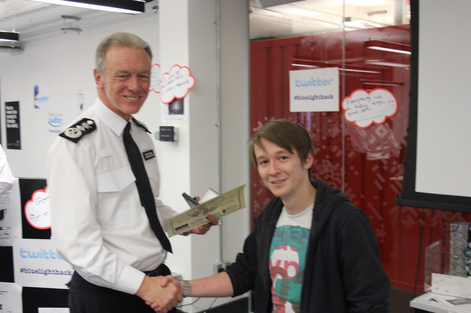 Tim receives his prize from Metropolitan Police Commissioner Sir Bernard Hogan-Howe